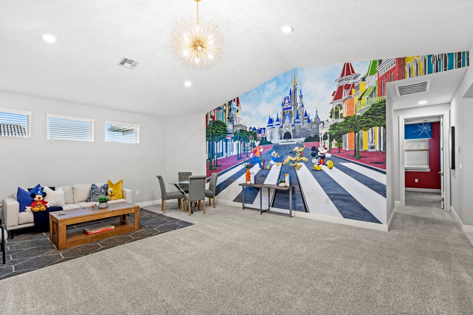family room with disney mural